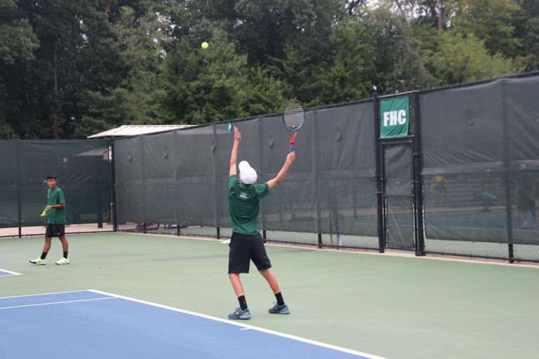 Boys varsity tennis singles players carry the Rangers to a 6-2 victory against East Grand Rapids