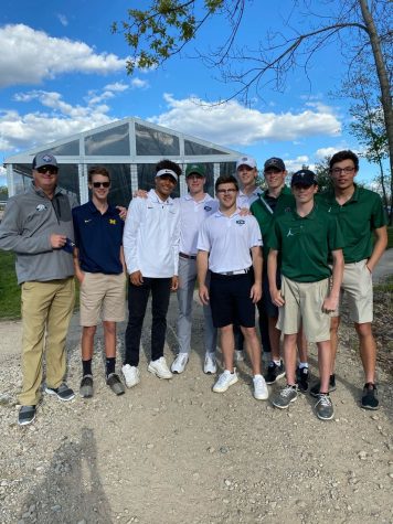 Nicholas (second to the left) poses for picture with his 2021 varsity golf teammates.