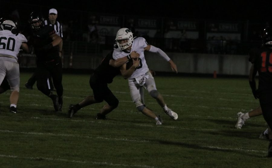 Hunter Robinson attempts to break a tackle.
