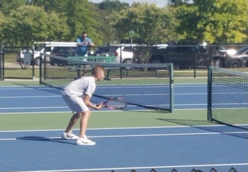 Will Hoffmann steps up on the tennis court with determination and leadership on the JV stage