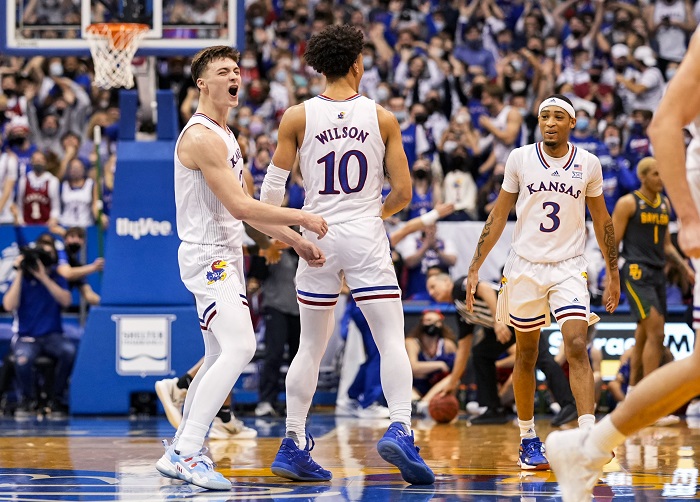 Feb 5, 2022; Lawrence, Kansas, USA; Kansas Jayhawks guard Christian Braun (2) celebrates with teammates after scoring against the Baylor Bears during the first half at Allen Fieldhouse.