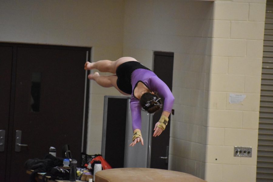 Sophomore Claire Worth showing off her skills on vault.