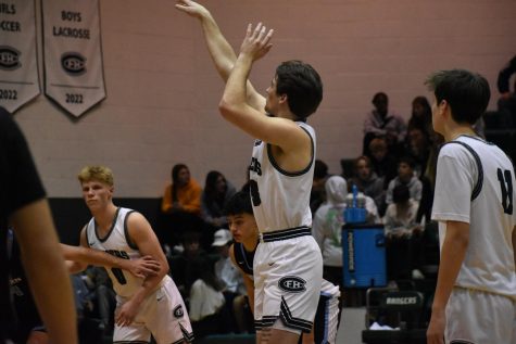 Boys varsity basketball executes a stunning comeback to triumph over Lowell