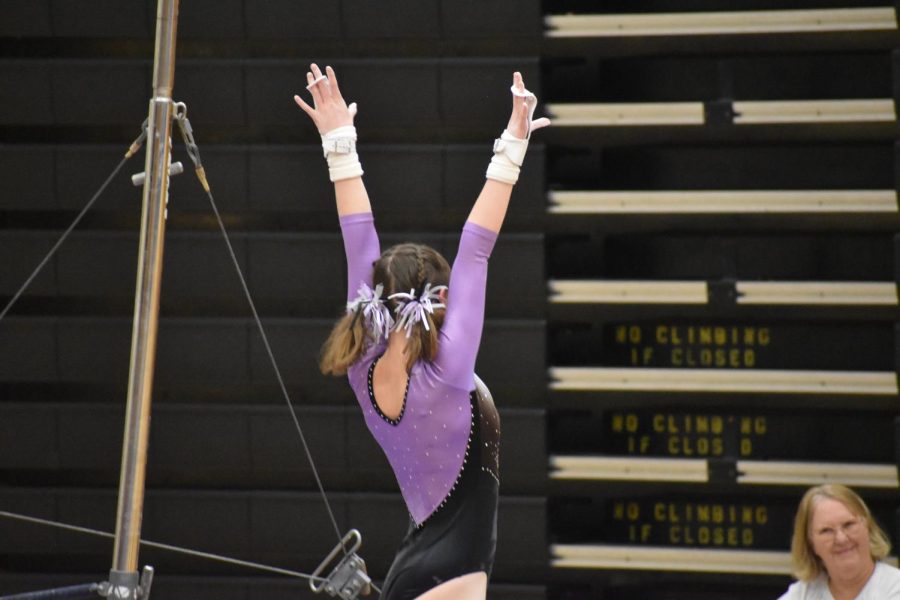 Lauren+Wolffis+saluting+after+her+great+performance+on+bars.+