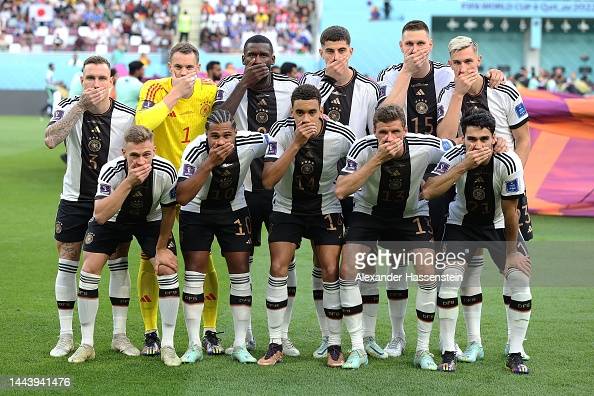 DOHA, QATAR - NOVEMBER 23: Germany players pose with their hands covering their mouths as they line up for the team photos prior to the FIFA World Cup Qatar 2022 Group E match between Germany and Japan at Khalifa International Stadium on November 23, 2022 in Doha, Qatar. (Photo by Alexander Hassenstein/Getty Images)