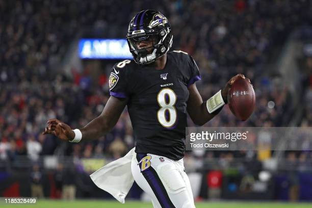 BALTIMORE, MARYLAND - NOVEMBER 03: Quarterback Lamar Jackson #8 of the Baltimore Ravens scores a first quarter touchdown  against the New England Patriots at M&T Bank Stadium on November 3, 2019 in Baltimore, Maryland. (Photo by Todd Olszewski/Getty Images)