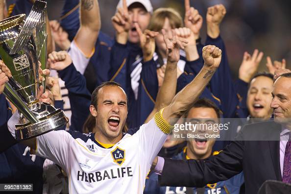 LA Galaxy Captain Landon Donovan celebrates and holds the Championship Cup after being presented it by Don Garber the Commissioner of MLS after MLS Cup Match between LA Galaxy and Houston Dynamo on November 20, 2011. LA Galaxy won the match with a score of 1-0 at the Home Depot Center in Los Angeles, CA (Photo by Ira L. Black/Corbis via Getty Images)