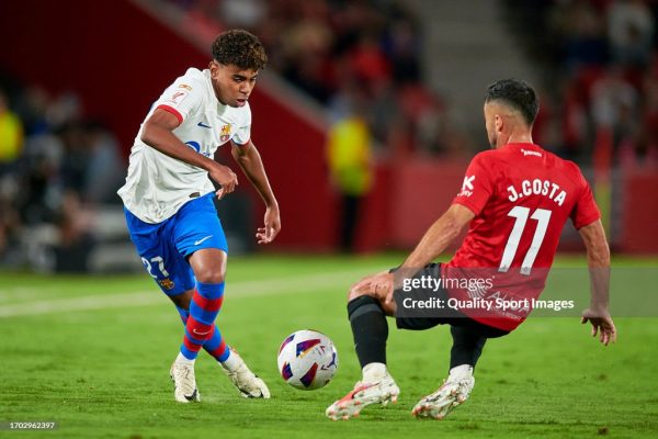 MALLORCA, SPAIN - SEPTEMBER 26: Jaume Costa of RCD Mallorca competes for the ball with Lamine Yamal of FC Barcelona during the LaLiga EA Sports match between RCD Mallorca and FC Barcelona at Estadi de Son Moix on September 26, 2023 in Mallorca, Spain. (Photo by Cristian Trujillo/Quality Sport Images/Getty Images)
