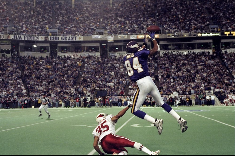 10 Jan 1999: Randy Moss #84 of the Minnesota Vikings goes up for a pass over Aeneas Williams #35 of the Arizona Cardinals during their NFC play-off game at the H. H. H. Metrodome in Minneapolis, Minnesota. The Vikings defeated the Cardinals 41-21.